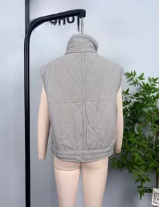 Close-up of grey quilted vest featuring wave patterns and stand-up collar detail