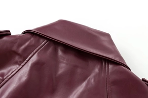 Close-up of wine red biker jacket showing premium faux leather texture and shoulder stitching