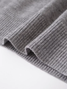 Close-up of the grey ribbed knit fabric texture on this stylish women's vest
