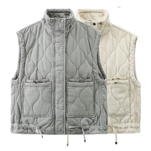 Close-up of diamond-quilted vests with stand collars and adjustable drawstring pockets