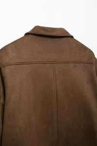 Detailed close-up of the back yoke and collar texture on a brown suede jacket