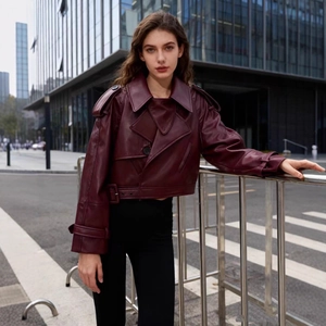 Chic burgundy faux leather moto jacket with wide lapels and belted waist detail
