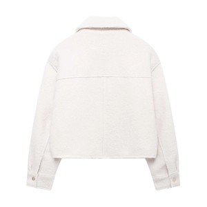 Detail view of beige textured wool blend jacket featuring drop shoulder and gold buttons