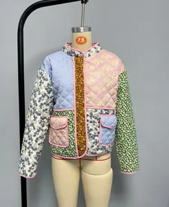Detail shot of a quilted patchwork jacket with mixed floral patterns and cotton filling