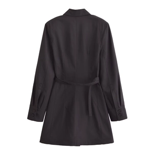 Back view of minimalist black blazer dress with waist belt and buttoned sleeves