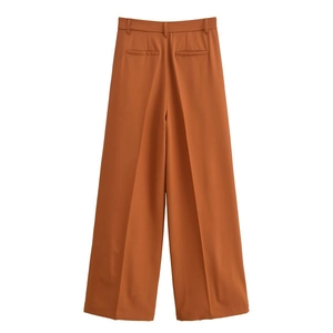 Detail view of high-waist wide-leg trousers back with welt pockets in caramel