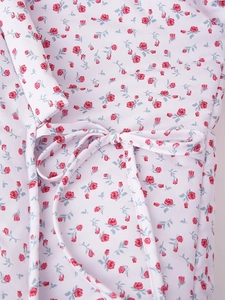 Detailed view of floral jacket showing waist tie belt and romantic rose flower pattern