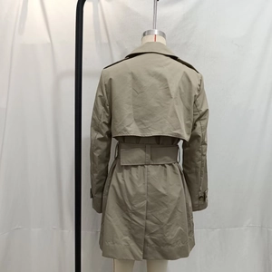 Back view of khaki classic trench coat with storm flap and belt on mannequin