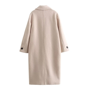 Rear view of long beige wool coat with lapel collar and buttoned cuffs for women
