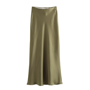 Close-up of olive green satin maxi skirt showing elegant silk texture and fabric shine