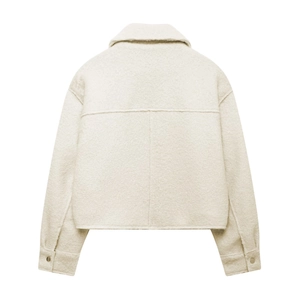 Back view of stylish off-white cropped boucle jacket with textured fabric and collar