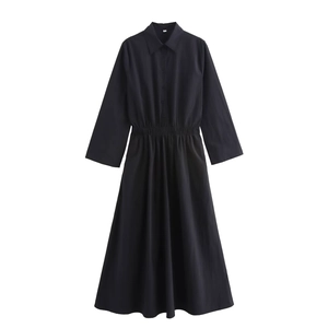 Detail of navy blue shirt dress featuring elastic waist, button placket and turn-down collar