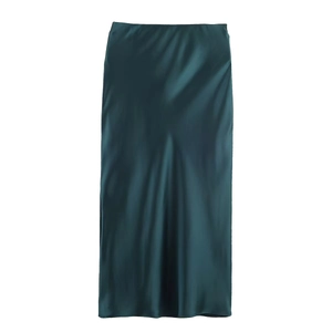 Elegant high-waisted dark green satin maxi skirt with smooth glossy silk texture