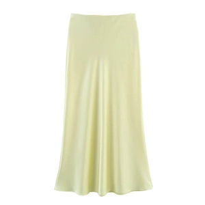 Detailed view of champagne satin midi skirt with elegant high waist and silky drape texture