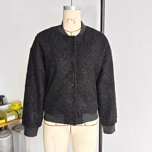Women's black faux shearling varsity jacket with button closure and ribbed cuffs
