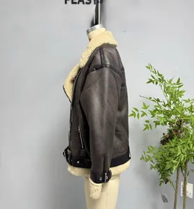 Detail of faux shearling collar and matte leather texture on winter aviator jacket