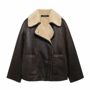 Close-up of deep brown faux leather jacket with cream faux shearling collar and pockets