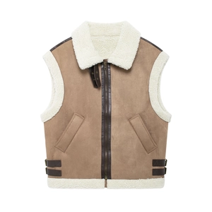 Detail of brown faux suede vest with warm white faux shearling trim and side buckle