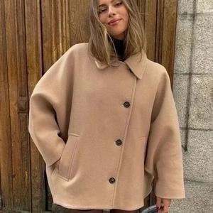 Women's camel wool short jacket featuring classic lapel and large black buttons