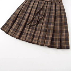 Women's pleated plaid mini skirt in brown British style with sharp pleats and matching belt