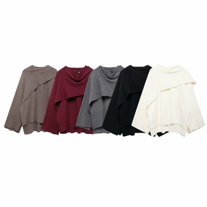 Women's asymmetrical knit sweaters in five colors featuring a side button and poncho style