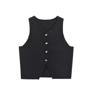 Close-up of black sleeveless vest with four irregular silver metal buttons and V-shaped hem