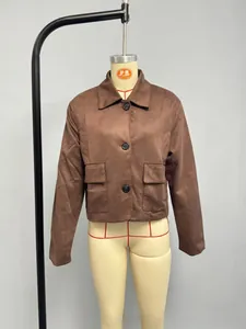 Macro shot of brown faux suede jacket featuring lapel collar and large flap pockets