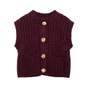 Women's burgundy chunky knit sweater vest with gold buttons on white background