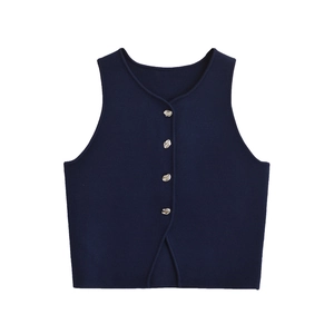 Detailed view of navy blue knitted vest with silver metal buttons and V-cut hemline