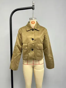 Detail view of khaki faux suede short jacket featuring classic collar and large black buttons