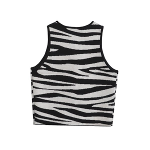 Close-up of black and white zebra pattern on a cropped knit vest with ribbed edges