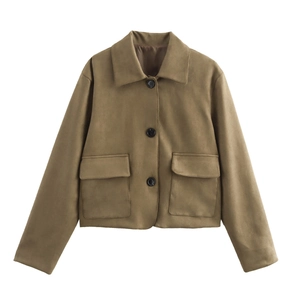 Detail view of tan cropped suede jacket showing lapel collar and large square flap pockets