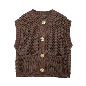 Close-up of thick knit brown vest showing gold buttons and ribbed texture detail