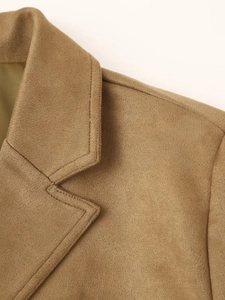 Close-up of lapel stitching and wool texture on a camel street style blazer coat