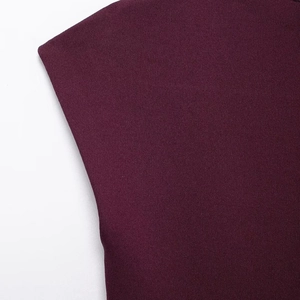 Deep burgundy asymmetric knitted mini dress with detailed rib texture and sharp shoulder cut