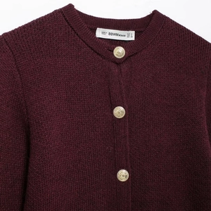 Women's wine red knit cardigan featuring stylish round neck and gold embossed metal buttons
