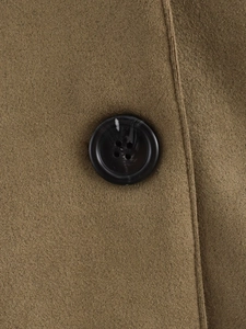 Detail view of brown faux suede jacket featuring premium marbled resin buttons
