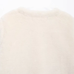 Women's chic white faux fur jacket with stylish double-sided knot buttons for winter
