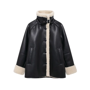 Detail of faux shearling collar and matte black leather on a women's biker jacket