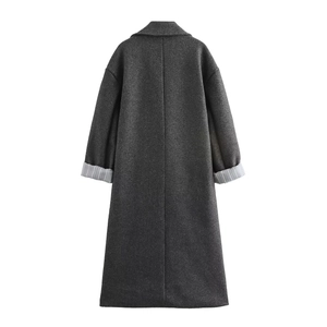 Detail of dark grey coat back view with lapel and stylish striped cuff lining