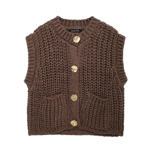 Women's dark brown chunky knit vest top with round neck and gold buttons on white backdrop