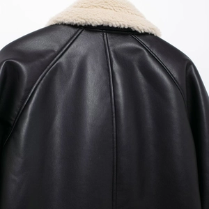 Women's black leather jacket with cream faux fur collar and raglan sleeve stitching