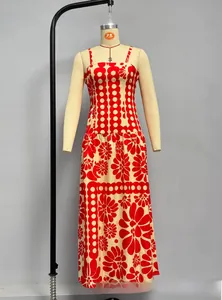 Detailed pattern of summer maxi dress with red floral print and polka dots fabric