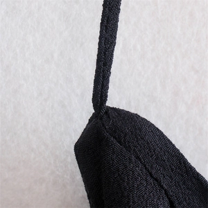 Macro detail showing the high-quality stitching and woven texture of the black halter strap