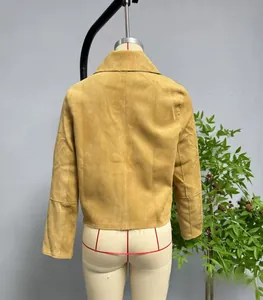 Close-up of a tan faux suede cropped jacket with soft texture and refined seams