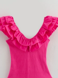 Close-up of the ruffled V-neckline on this pink ribbed knit sleeveless jumpsuit for women