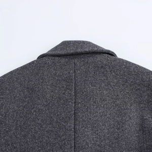 Deep grey double-breasted coat with textured wool finish and detailed back seam construction