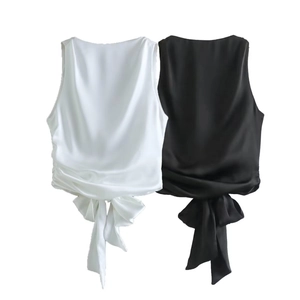Detail of satin sleeveless tops in black and white with elegant hem tie knot feature