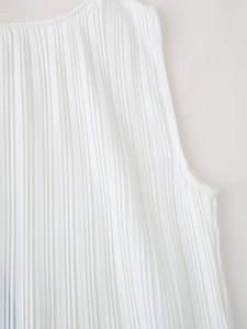 Macro detail of vertical pleated texture on white sleeveless summer dress fabric