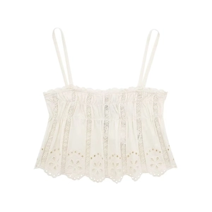 Close-up of white camisole top with floral embroidery and delicate lace details